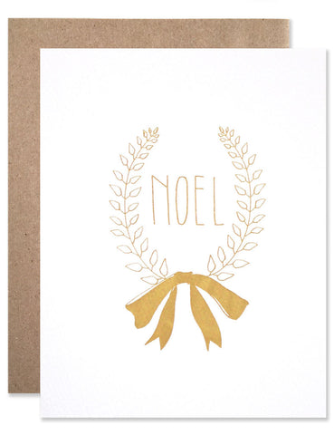 Noel laurel wreath illustrated by Hartland Brooklyn featured in gold foil.